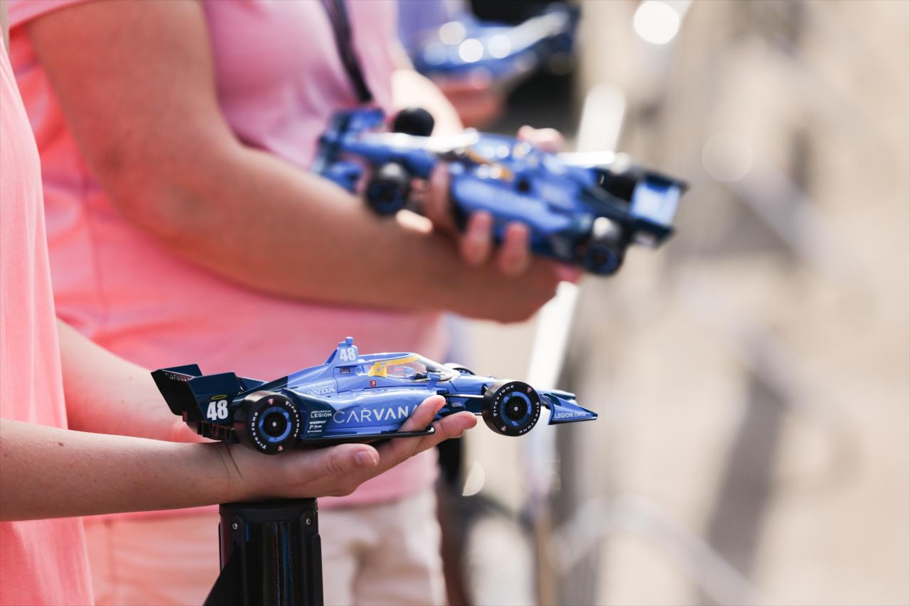 Fans holding Jimmie Johnson diecasts - Honda Indy 200 at Mid-Ohio - By: Chris Owens -- Photo by: Chris Owens